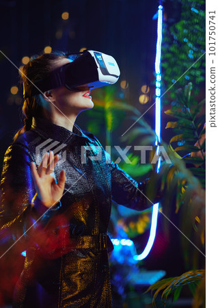 trendy woman in metaverse in vr headset exploring trendy woman in metaverse in vr headset exploring 101750741