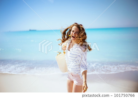 happy elegant woman having fun time at beach happy elegant woman having fun time at beach 101750766