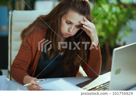 business owner woman in green office working with documents business owner woman in green office working with documents 101750829