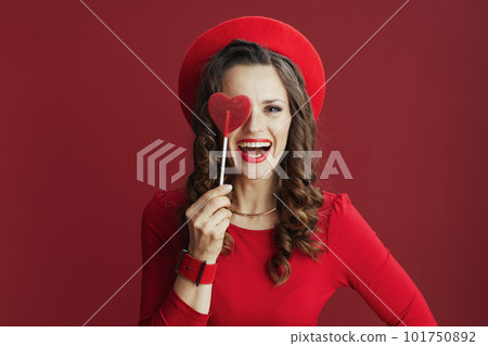 happy stylish woman with heart shaped candy 101750892