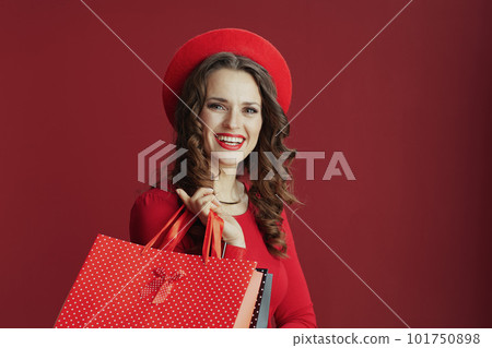 smiling stylish woman in red dress and beret smiling stylish woman in red dress and beret 101750898