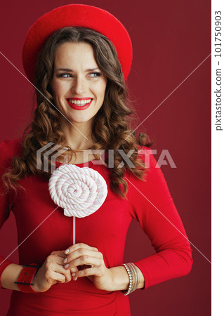 smiling elegant woman in dress and beret against background smiling elegant woman in dress and beret against background 101750903