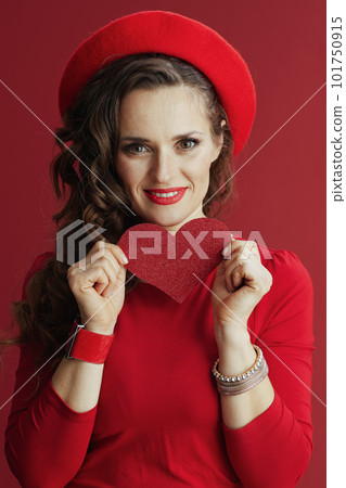 smiling elegant woman in dress and beret against background 101750915