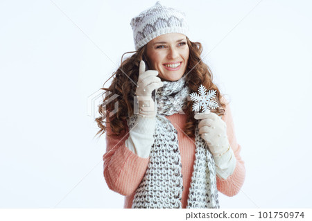 smiling modern woman on white speaking on smartphone 101750974