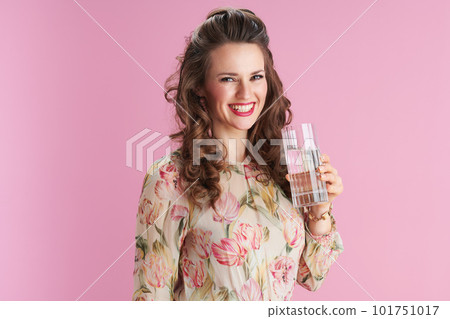 smiling elegant woman with long wavy brunette hair on pink 101751017