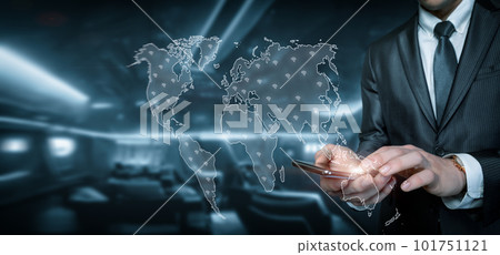 Businessman working on a mobile device with a world map . Businessman working on a mobile device with a world map . 101751121