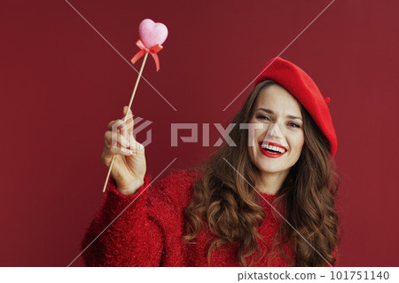 happy stylish woman in red sweater and beret 101751140