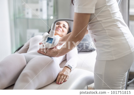 Female skincare treatment professional perform beautification procedure by a modern device 101751815