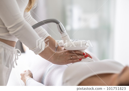 Belly skin improvement by a modern LPG endermology device in a professional beauty studio 101751823