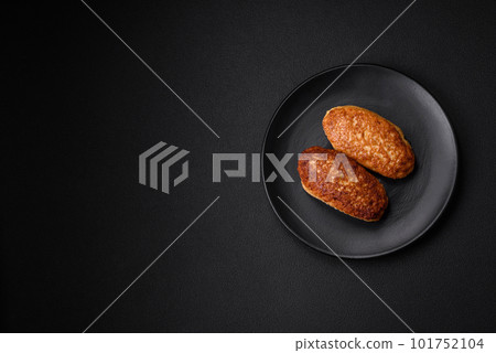 Delicious fried cutlets or meatballs from minced fish with spices and herbs 101752104