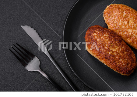 Delicious fried cutlets or meatballs from minced fish with spices and herbs 101752105