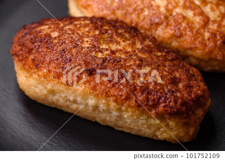 Delicious fried cutlets or meatballs from minced fish with spices and herbs 101752109