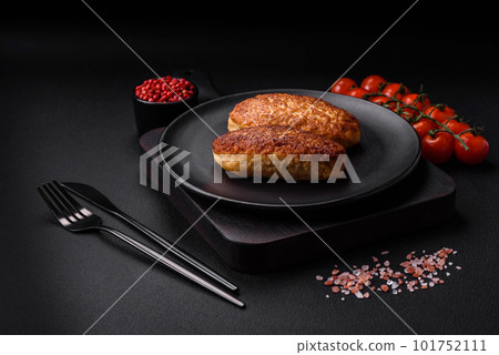 Delicious fried cutlets or meatballs from minced fish with spices and herbs Delicious fried cutlets or meatballs from minced fish with spices and herbs 101752111