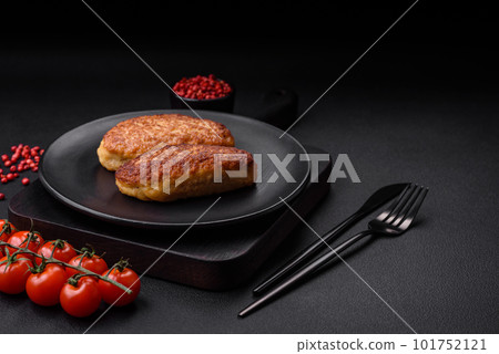 Delicious fried cutlets or meatballs from minced fish with spices and herbs Delicious fried cutlets or meatballs from minced fish with spices and herbs 101752121