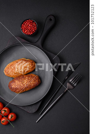 Delicious fried cutlets or meatballs from minced fish with spices and herbs Delicious fried cutlets or meatballs from minced fish with spices and herbs 101752123
