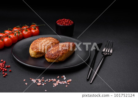 Delicious fried cutlets or meatballs from minced fish with spices and herbs 101752124