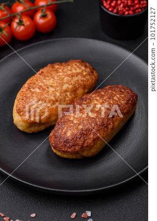 Delicious fried cutlets or meatballs from minced fish with spices and herbs Delicious fried cutlets or meatballs from minced fish with spices and herbs 101752127