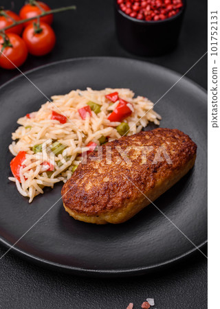 Delicious fried cutlets or meatballs of minced fish with rice Delicious fried cutlets or meatballs of minced fish with rice 101752131