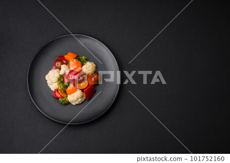 Delicious salad of fresh cherry tomatoes, sweet peppers, broccoli and cauliflower 101752160