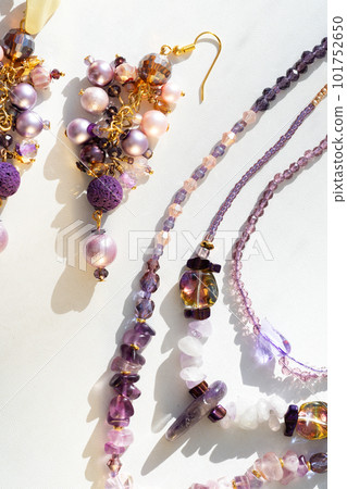 trendy author  earrings with various colors pearls with chokers around white background. fashion and handmade concept 101752650