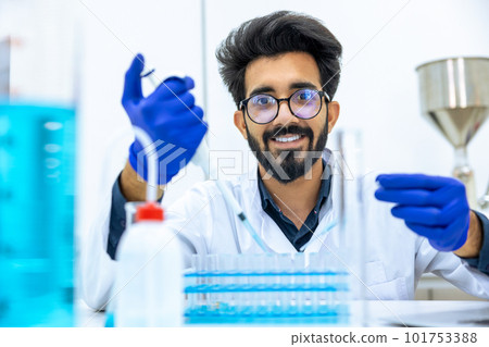 Man scientist dripping chemicals to test tubes, biochemist conducting experiments to discover drugs 101753388