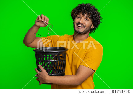 Man taking off, throwing out glasses into bin after medical vision laser treatment therapy surgery Man taking off, throwing out glasses into bin after medical vision laser treatment therapy surgery 101753708
