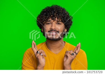 Indian man crossed fingers asking good luck, wishing good exam results, win victory lottery jackpot Indian man crossed fingers asking good luck, wishing good exam results, win victory lottery jackpot 101753720
