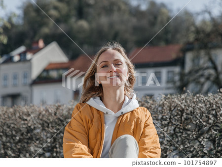 A beautiful young stylish woman walking in the city. Spring mood, dreaming and waiting, a lifestyle concept 101754897