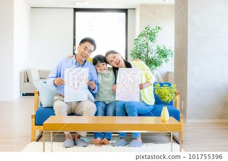 Respect for the Aged Day Grandparents receiving portraits from their grandchildren 101755396