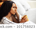 After a hard day at work, a woman experiences stress and headache. 101756023