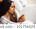 Woman experiencing severe headache due to problems and stress. 101756024