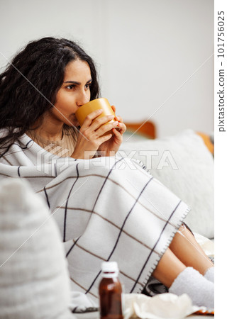 Recovery at home. Woman drinking hot drink and curing at home. Recovery at home. Woman drinking hot drink and curing at home. 101756025