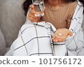 Hands holding medicine and a glass of water. Pills and health care concept. 101756172