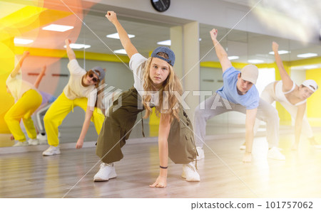 Teen girl in cap dancing modern dances 101757062