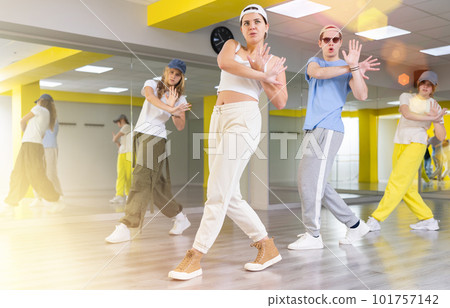 Dance class for teenages, girl and boy training in dance studio Dance class for teenages, girl and boy training in dance studio 101757142