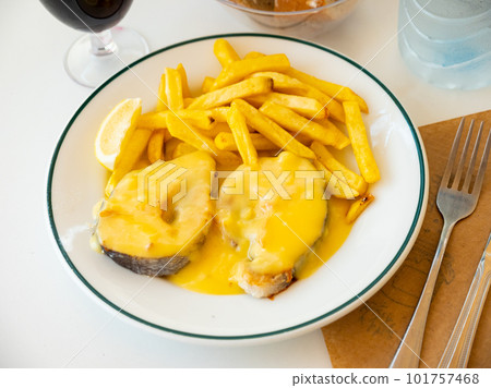 Stewed hake Merluza en salsa holandesa with potatoes Stewed hake Merluza en salsa holandesa with potatoes 101757468