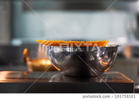 Spaghetti pot on stove for cooking pasta in the kitchen room 101758101