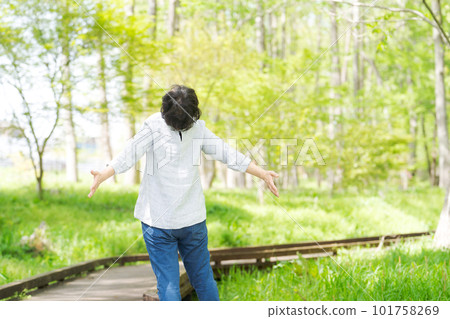 Image of senior woman exercising in park 101758269