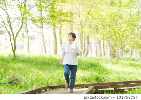 Image of senior woman exercising in park Image of senior woman exercising in park 101758757
