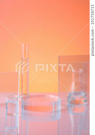 Front view of transparent podium with laboratory glassware filled colorless liquid and ribbed acrylic sheets on orange background. Blank space for display product. Science and medical background Front view of transparent podium with laboratory glassware filled colorless liquid and ribbed acrylic sheets on orange background. Blank space for display product. Science and medical background 101759715
