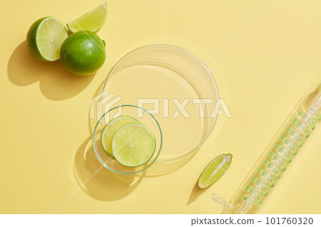 Round transparent podium with a glass petri dish of Lime (Citrus aurantiifolia) slices placed on, displayed with a condenser. Stage showcase on the podium for product presentation Round transparent podium with a glass petri dish of Lime (Citrus aurantiifolia) slices placed on, displayed with a condenser. Stage showcase on the podium for product presentation 101760320