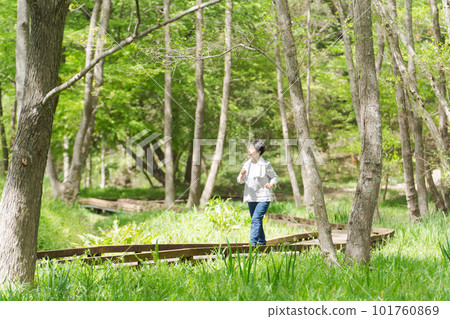 Image of senior woman exercising in park 101760869