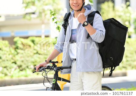 Delivery man delivering by bicycle Delivery man delivering by bicycle 101761137