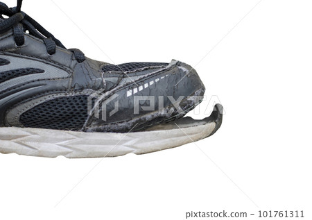 side view broken old black canvas shoes isolated on white background with clipping path 101761311