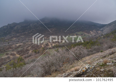 Landscape of Karadag Reserve in spring. View of mountains in fog and clouds. Crimea Landscape of Karadag Reserve in spring. View of mountains in fog and clouds. Crimea 101762495