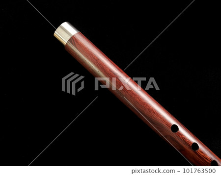 Close up shot of Thai flute. Flute made from siam rosewood with aluminum wrap design Close up shot of Thai flute. Flute made from siam rosewood with aluminum wrap design 101763500
