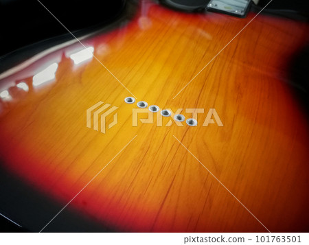 close up shot of Holes for String in eletronic back side of guitar body style close up shot of Holes for String in eletronic back side of guitar body style 101763501