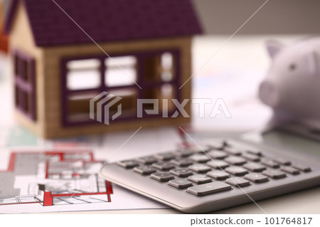 Architectural house plan house layout and calculator on table 101764817