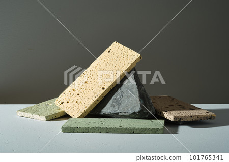Colorful rectangle bricks are randomly decorated on dark stone on black background. Empty space for product display and place your design. Blank minimal background. Front view 101765341