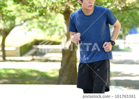 Young man running in nature 101765381